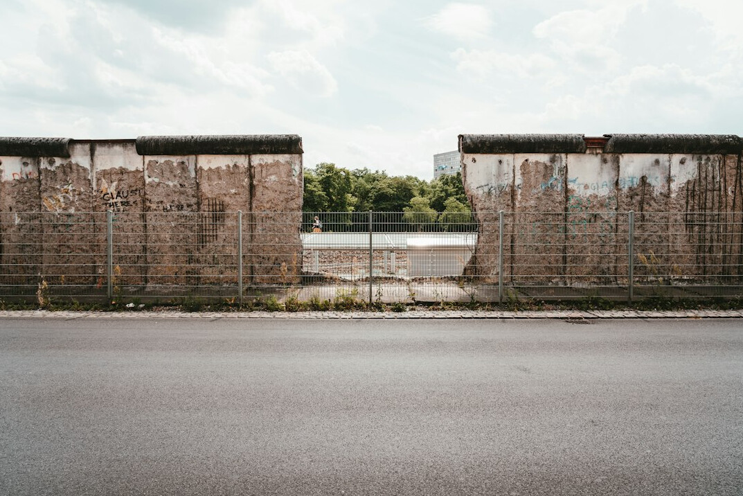 Remaining section of the Berlin Wall with weathered concrete texture